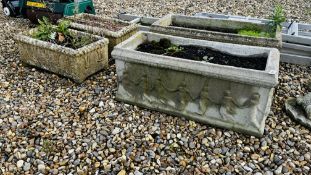 A PAIR OF LARGE STONEWORK PLANTING TROUGHS RELIEF DECORATED WITH DANCING FIGURES PLUS FURTHER PAIR