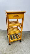 A SMALL WHEELED TILED TOP KITCHEN WORK STATION, W 38 X D 38 X H 87CM.