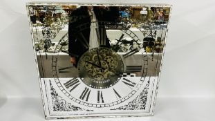 REPRODUCTION OVERSIZE WALL CLOCK WITH VISIBLE MOVEMENT IN ANTIQUE EFFECT CASE.
