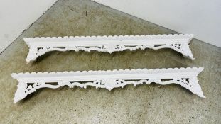 A PAIR OF CARVED AND MOULDED ORNATE WINDOW PELMETS - LENGTH 200CM.