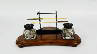CHINESE PEN STAND WITH 2 INKWELLS WITH METAL TOPS AND HARDWOOD BASE.