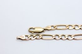 A 9CT GOLD FIGARO LINK BRACELET.