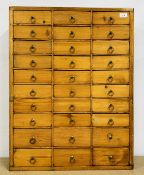 AN ANTIQUE PINE 30 DRAWER HABERDASHERY CHEST W 61CM D 13CM H 79CM.