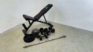 A FLYBIRD GYM BENCH ALONG WITH A COLLECTION OF MIXED WEIGHTS.