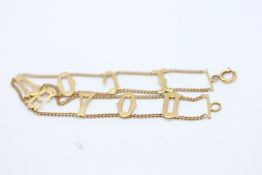 A 9CT GOLD EDWARDIAN BRACELET THE TWO CHAINS INTERLINKED WITH LETTERS READING 'I LOVE YOU'.