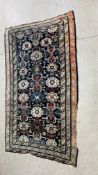 A LARGE BLUE / PINK PATTERNED CARPET WITH SHAPED MOTIFS, PROBABLY CAUCASION 3.05 X 1.7M.