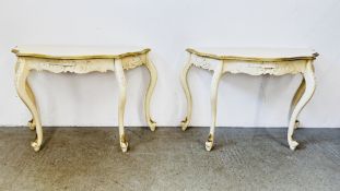 A PAIR OF REPRODUCTION SHAPED DEMI LUNE SIDE TABLES WITH CREAM PAINTED FINISH AND GILT DETAIL.