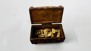 A VINTAGE TORTOISESHELL TRINKET / PATCH BOX CONTAINING 13 MINIATURE PRISONER OF WAR DOMINOES.