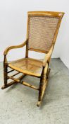 ANTIQUE BEECH WOOD ROCKING CHAIR WITH RATTAN WORK SEAT AND BACK.