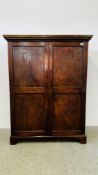 A GEORGE III MAHOGANY TWO DOOR CUPBOARD WITH INDENTIL CORNICE ON BRACKET FEET.