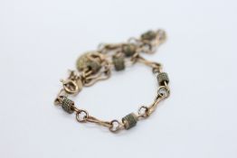 A 9CT GOLD BATON AND LINK FANCY BRACELET.