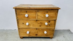 SMALL ANTIQUE WAXED PINE TWO OVER TWO CHEST OF DRAWERS WITH WHITE CERAMIC KNOBS STANDING ON BUN