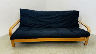 A BEECHWOOD FRAMED FUTON BED SETTEE LENGTH 207CM.
