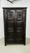 ANTIQUE TWO DOOR OAK CABINET WITH HEAVILY CARVED DETAIL, W 112CM X D 43CM X H 187CM.