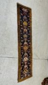 A PERSIAN RUNNER - THE PRINCIPAL MOTIFS ON A DARK BLUE GROUND 2.7M X .69M.