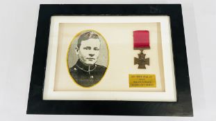 A FRAMED AND MOUNTED REPRODUCTION MEDAL SGT. ROBERT SPALL V.C.