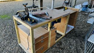 A BESPOKE CARPENTRY WORK STATION HOUSING TABLE SAW AND ROUTER (TABLE SAW GUARD PRESENT AND TO BE