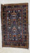 AN EASTERN BLUE/BROWN PATTERNED CARPET,