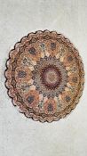AN IMPRESSIVE CIRCULAR FRINGED RUG WITH SHIELD PANELS DIAM 150CM.