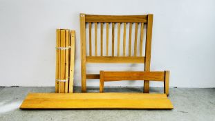 A MODERN LIGHT OAK SINGLE BEDSTEAD.