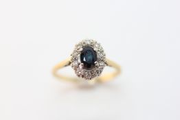 AN 18CT GOLD SAPPHIRE AND DIAMOND SET RING,