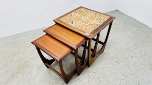 A NEST OF THREE GRADUATED RETRO TEAK NATHAN STYLE OCCASIONAL TABLES.