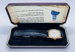 A VINTAGE 9CT GOLD CASED WRIST WATCH MARKED 