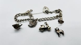 VINTAGE SILVER GATE BRACELET WITH 3 CHARMS ATTACHED WITH 3 EXTRAS UNATTACHED.