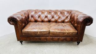 A TAN LEATHER TWO SEATER CHESTERFIELD SOFA BY 
