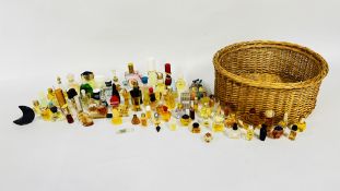 A BASKET OF PERFUME SAMPLES AND MINIATURES TO INCLUDE MANY DESIGNER BRANDED EXAMPLES MARKED HUGO