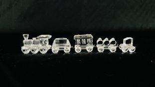 A SWAROVSKI CRYSTAL TRAIN AND 4 VARIOUS CARRIAGES / ROLLING STOCK, WITH PRESENTATION BOXES.