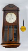 A VINTAGE OAK CASED WALL CLOCK MARKED J.W. BENSON H 78 X W 34CM D 18CM.