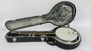 A REMO ASHLAND BANJO IN A FITTED PROTECTIVE HARD CASE.