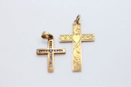 TWO 9CT GOLD CROSS PENDANTS, ONE SET WITH TWENTY SMALL DIAMONDS.