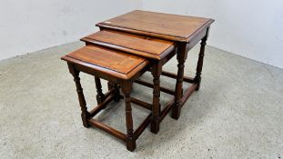 A GRADUATED SET OF THREE SIMON SIMPSON OCCASIONAL CHERRYWOOD TABLES THE LARGEST 61 X 46CM.