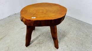A HARDWOOD TREE SLAB OCCASIONAL TABLE ON FOUR PINE SUPPORTS 55 X 47CM X H 51.5CM.