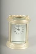 A SMALL ROUND SILVER CARRIAGE CLOCK.7cm high.