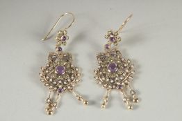 A PAIR OF 9CT GOLD DIAMOND, AMETHYST, PERIDOT AND PEARL SUFFRAGETTES COLOURED EARRINGS.