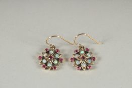 A PAIR OF 9CT GOLD RUBY AND OPAL EARRINGS.