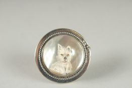 A SILVER REVERSE ESSEX CRYSTAL CIRCULAR TERRIER BROOCH.