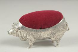 A large pig pin cushion, 10cm long.