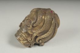 A brass and enamel octopus vesta case.