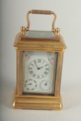 A MINIATURE CARRIAGE CLOCK with Sevres panel.8cm high.