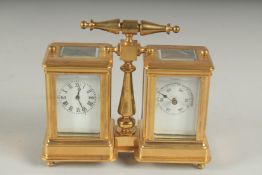 A DOUBLE BRASS CARRIAGE CLOCK AND BAROMETER with carrying handle.9cms high.