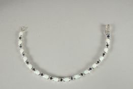 A SILVER OPAL AND SAPPHIRE LINE BRACELET.