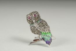 A silver plique enamel ruby eye owl brooch in a box.