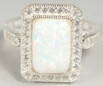 A silver octagonal art Deco style opal and cubic zirconia ring, size Q, in a box.