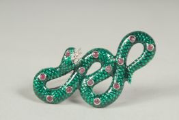 A silver ruby and enamel snake brooch or pendant in a box.
