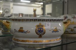 A reproduction Chinese armorial foot bath or jardiniere.