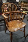 A 19th century yew and elm splat back Windsor armchair (some damage).